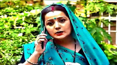 Indian desi wife in blue saree on phone, mature beauty talking