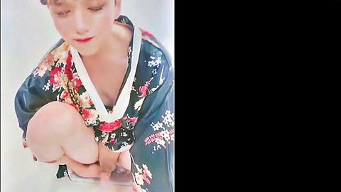 Petite Asian in floral kimono robe hugs knees spreading legs teasing crotch
