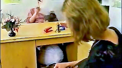 Blonde with big white ass exposed under desk, brunette smoking nearby