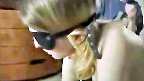 Blonde amateur submissive in collar and blindfold, BDSM pose