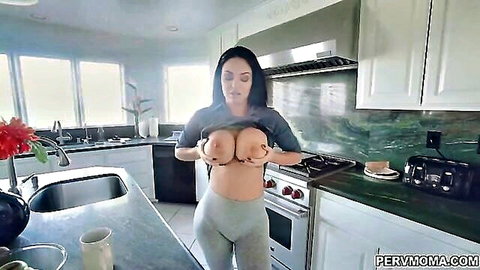 Brooke lifts gray shirt to expose large natural tits in tight leggings