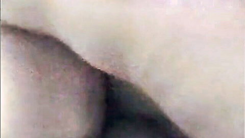 Close-up of pale girl's bare ass cheeks with visible butt crack spread open.