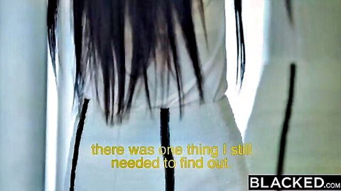 Long-haired East Asian woman in tight white dress viewed from behind in Blacked interracial teaser