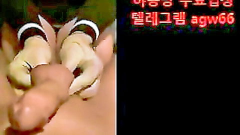 Korean woman hands gripping erect penis in close-up handjob