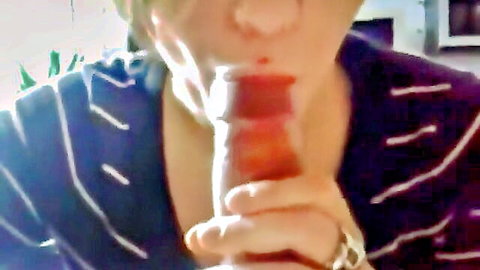 Amateur girl in striped shirt giving close-up blowjob to cock