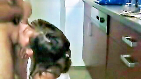 Brunette Asian woman giving oral sex in kitchen, quick blowjob leading to facial