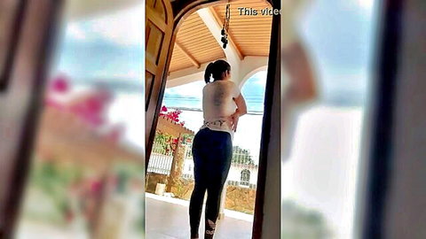 Curvy Latina in tight black leggings showing big ass from behind