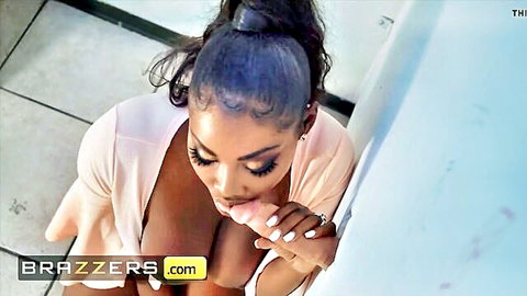 Osa Lovely ebony beauty teases with full lips and exposed curves in pink robe
