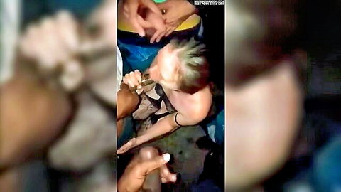 Blonde woman's huge tits groped by multiple black hands in amateur interracial gangbang with BBC cock at her mouth