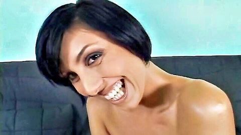 Eva Black smiling topless while teasing herself intimately