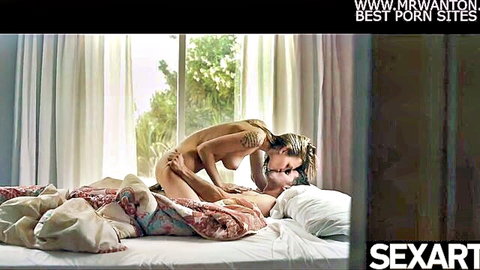 Tattooed busty babe with natural big tits nude straddling boyfriend kissing passionately on bed