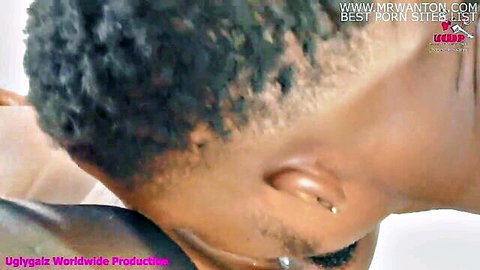 Closeup of black man's tense neck and ear piercing in rough sex scene