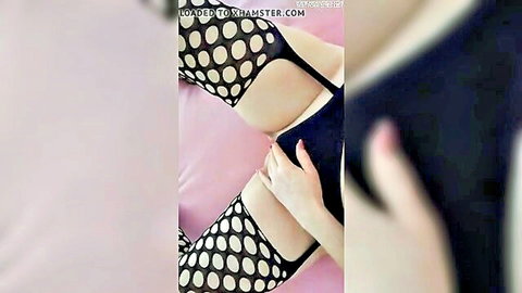 Amateur wife in sheer black lingerie and polka dot stockings teasing her tits