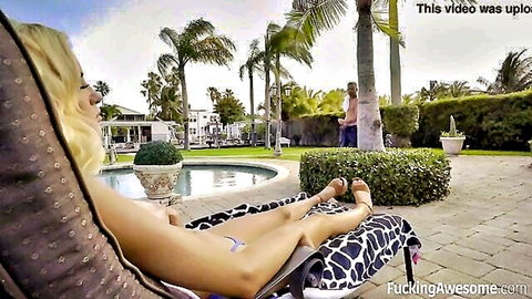 Naomi Woods in zebra bikini lounging poolside with gardener