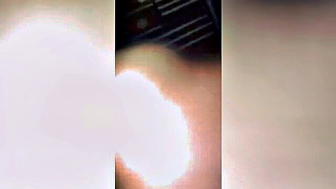 Blurry low-light thumbnail of hand on strings, dim adult clip