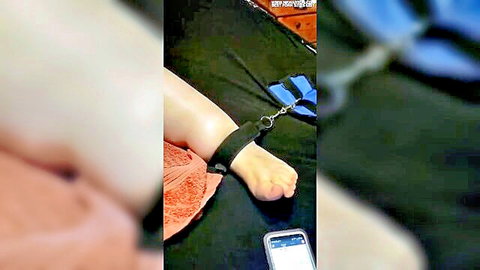 Bound woman with ankle restraints needing intense orgasm in HD video