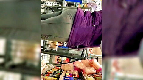 Mature woman bending over with deep wedgie in gray pants, public tease