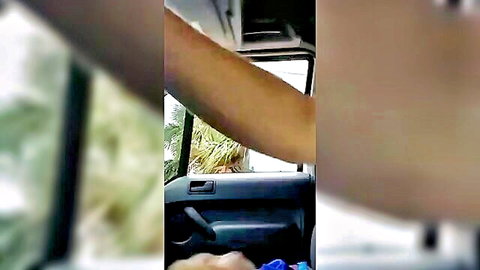Blurry amateur tease of woman's arm in car offering seductive help