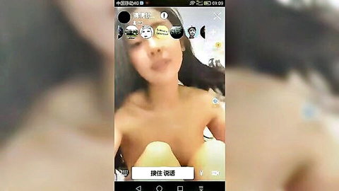 Topless Chinese babe with big bare tits smiling in sexy live cam stream