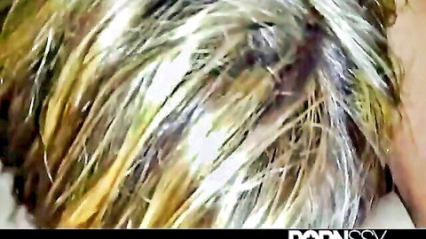 Closeup of blonde mature MILF's tousled highlighted hair