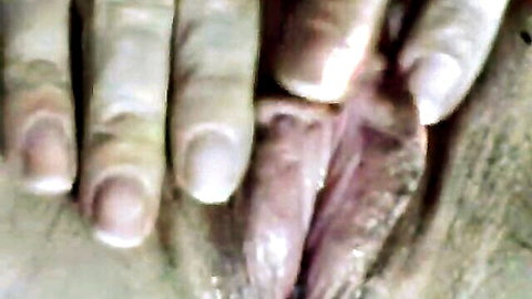 Close-up of wet pussy with fingers spreading labia for orgasm view