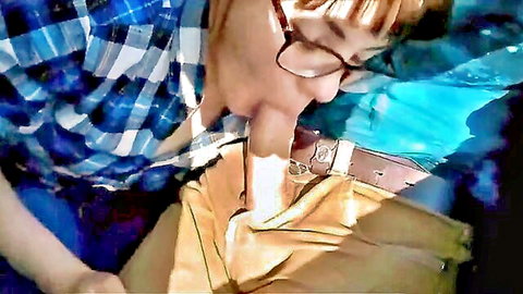 Asian woman in glasses and plaid shirt giving POV blowjob on train