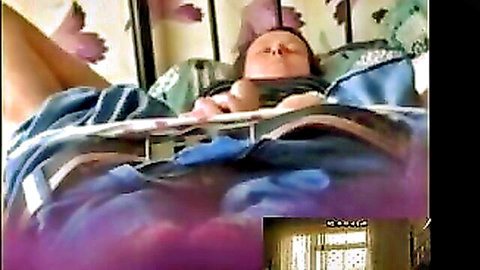 Amateur wife masturbating to orgasm on bed, eyes closed in pleasure