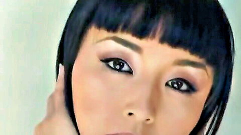 Oriental beauty with black bob haircut and seductive gaze, close-up portrait