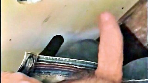 Amateur personal glory hole with hand holding black dildo through wall hole