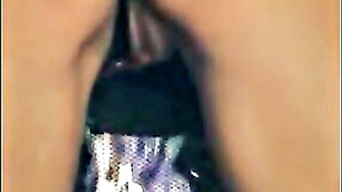 Close-up of wife's wet pussy with black toy insertion