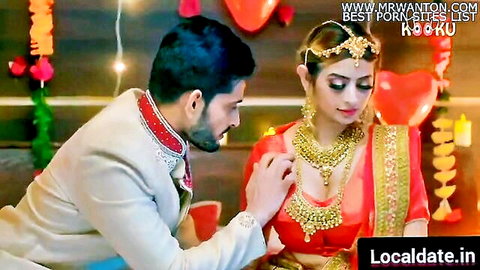 Indian bhabhi in red saree with cleavage, touched by groom on unsatisfied suhagrat
