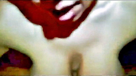 Blurry close-up of lewd wife in ecstasy with visible pussy and red toy penetration