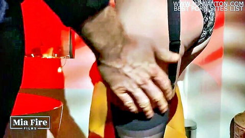 Mia Fire in black lingerie gets ass grabbed in kinky BDSM scene