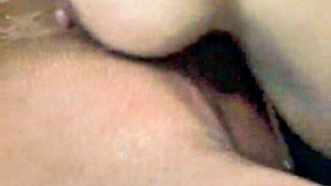 Extreme close-up of wet pink pussy lips spread open during steamy Asian massage