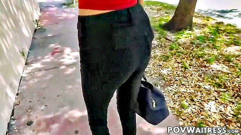 Natalia Nix as slender waitress in tight black pants, POV ass view outdoors