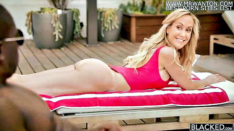 Smiling blonde in pink bikini lounging poolside with black stud - Blacked interracial tease