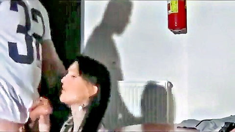 Belle Claire kneeling blowjob to man in football jersey