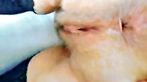 Close-up of spread ass cheeks exposing tight anus in amateur mobile porn