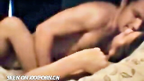 Amateur Asian couple intimate sex in bed, passionate embrace