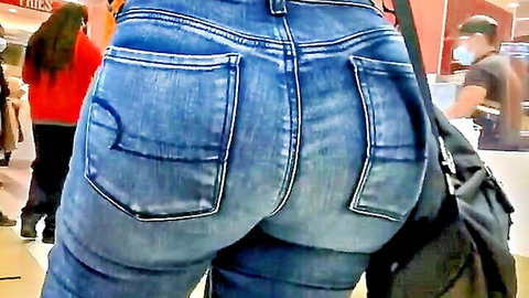 Latina woman with big booty in tight jeans walking in public
