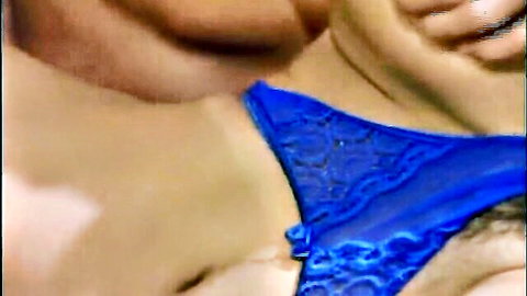 Man passionately kissing woman's neck while she wears sexy blue lace bra