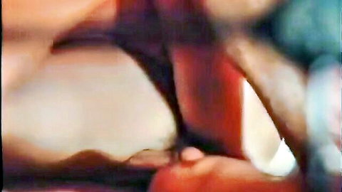 Michele Perello topless in 1976 French adult film Corps brulants, close-up on curves