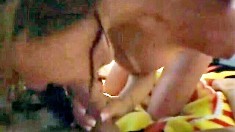 Brittany Blue in close-up amateur blowjob, glasses on, gripping shaft