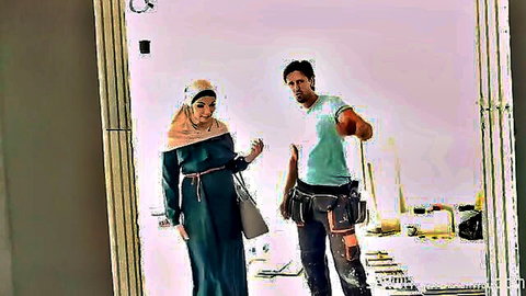 Hijabi woman in green dress flirts with construction worker in Muslim cuckold scene