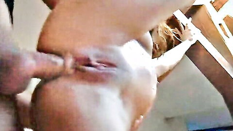 Blonde woman in intense doggy style penetration close-up