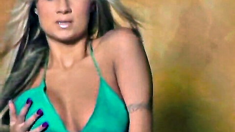 Amy Reid blonde bombshell strips in green dress, teasing cleavage in hallway