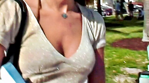 Ally Ann in shiny deep V-neck top showing cleavage, outdoor pickup scene