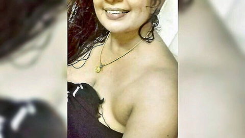 Smiling South Asian babe exposes juicy tit as wet black bra slips off shoulder