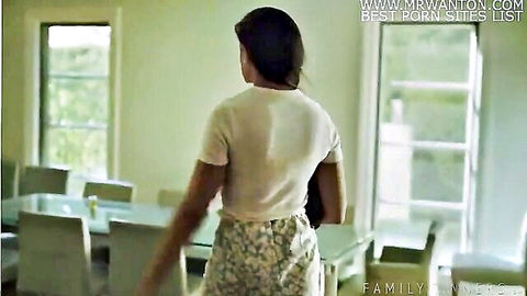 Penny Barber in Family Issues, curvy brunette MILF in white top and skirt from behind