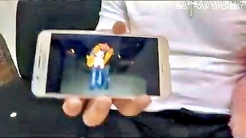 Tattooed hand holds phone displaying wife in white lingerie roughly fucked by masked man in threesome cuckold scene
